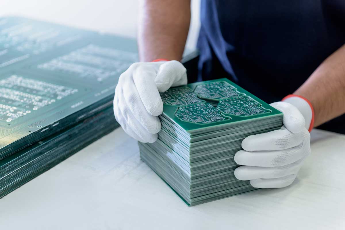 PCB Manufacturing worker preparing for compliance check