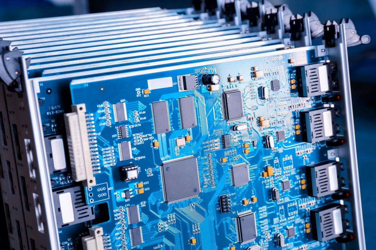 blue motherboard closeup in a PCB Manufacturer warehouse